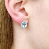 Passiflora - 14KT White Gold Oval Aquamarine and Diamond Halo Stud Earrings
