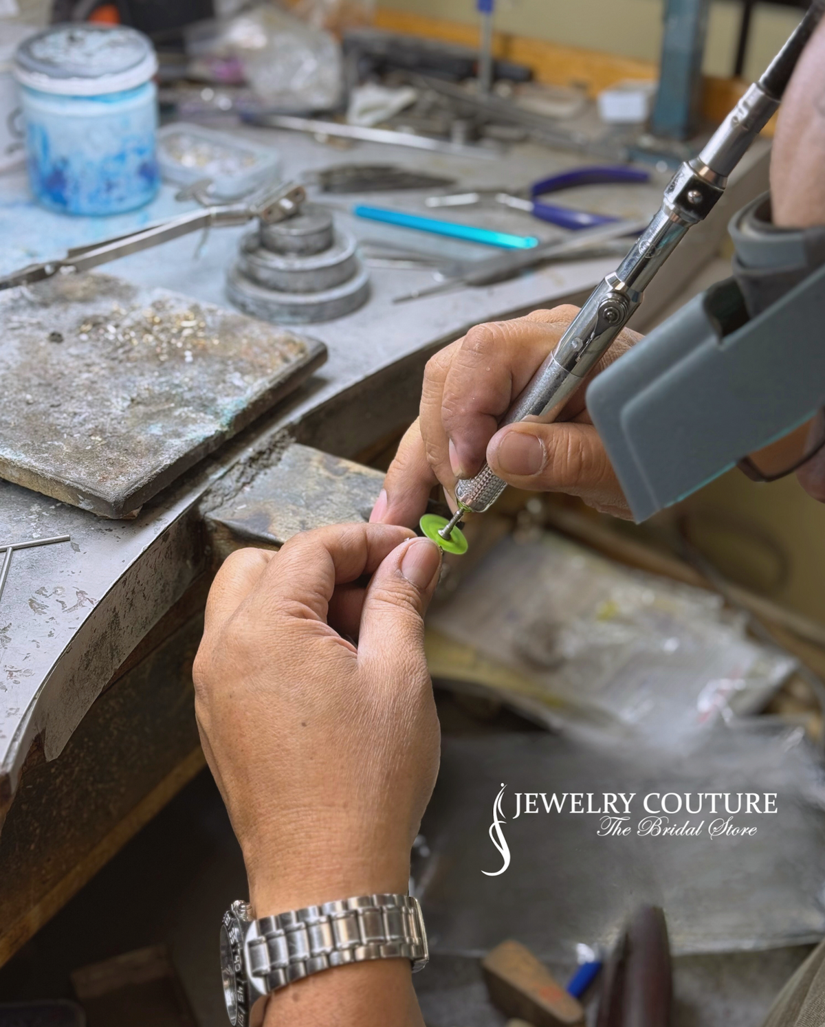 Jewelry Couture master jeweler hand-finishing a DecoAge ring at the bench in Ventura
