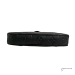 Black leather belt with embossed design on a white background