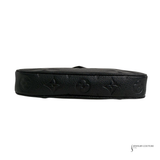 Black leather belt with embossed design on a white background
