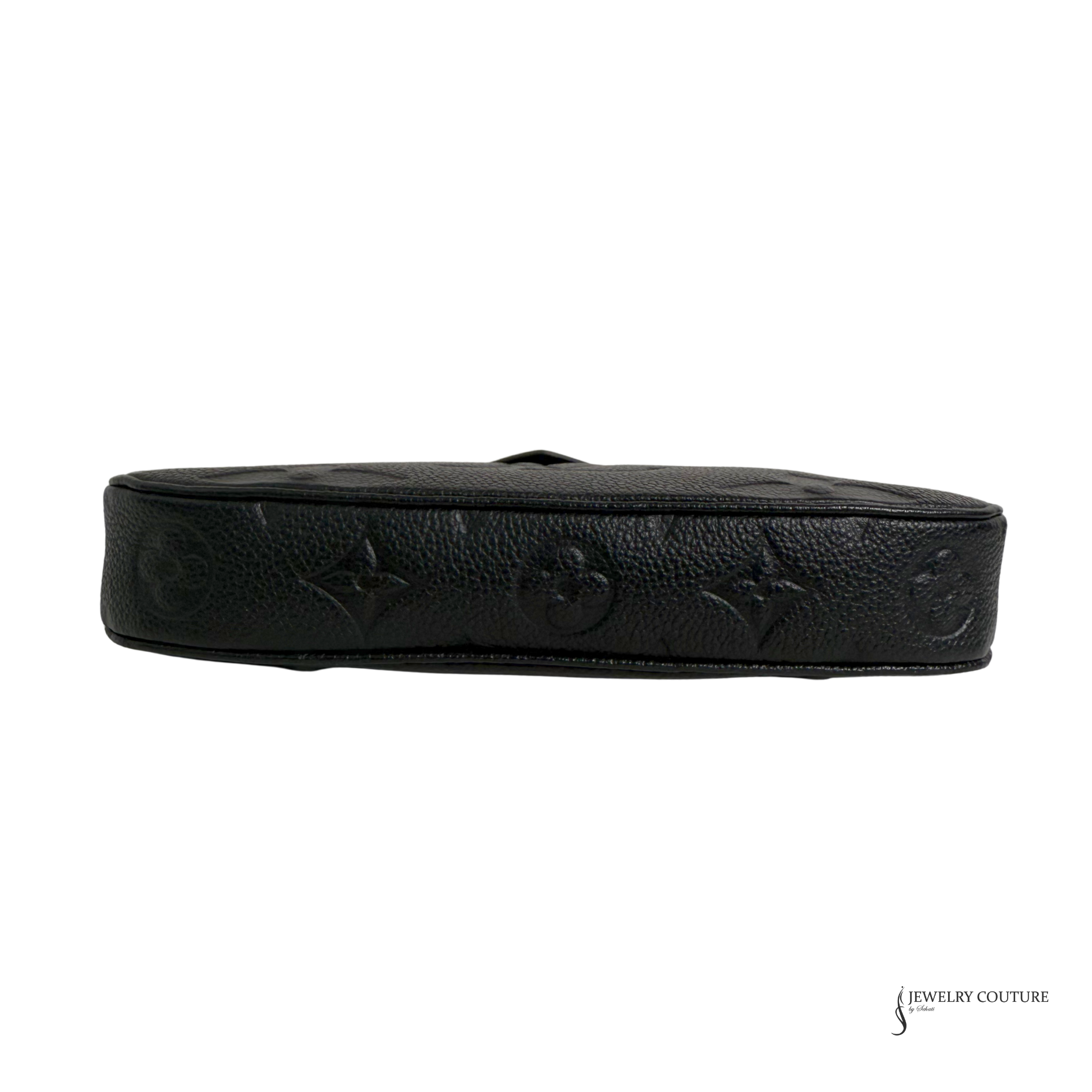 Black leather belt with embossed design on a white background