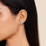 Gabriel & Co. blue topaz halo stud earring, side view
