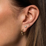 Gabriel & Co. 14K yellow gold pyramid studs worn