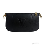 Black leather pouch with gold hardware on a white background