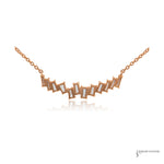 Back of the 14K rose gold offset baguette diamond necklace