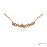 Back of the 14K rose gold offset baguette diamond necklace