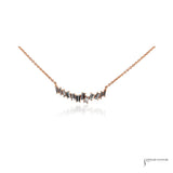 14K rose gold baguette diamond necklace on an adjustable chain