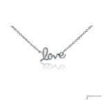 Diamond love script necklace in 14K white gold, close-up of pave diamonds