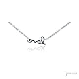 Back of the 14K white gold love script pendant showing the polished finish