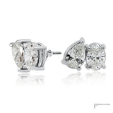 Pear and oval lab grown diamond stud earrings in 14K white gold, angled side view