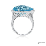 14K white gold pear blue topaz and diamond halo ring, profile view