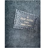 Louis Vuitton logo on a textured surface