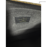 Close-up of a Louis Vuitton bag with a visible logo.