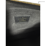 Close-up of a Louis Vuitton bag with a visible logo.