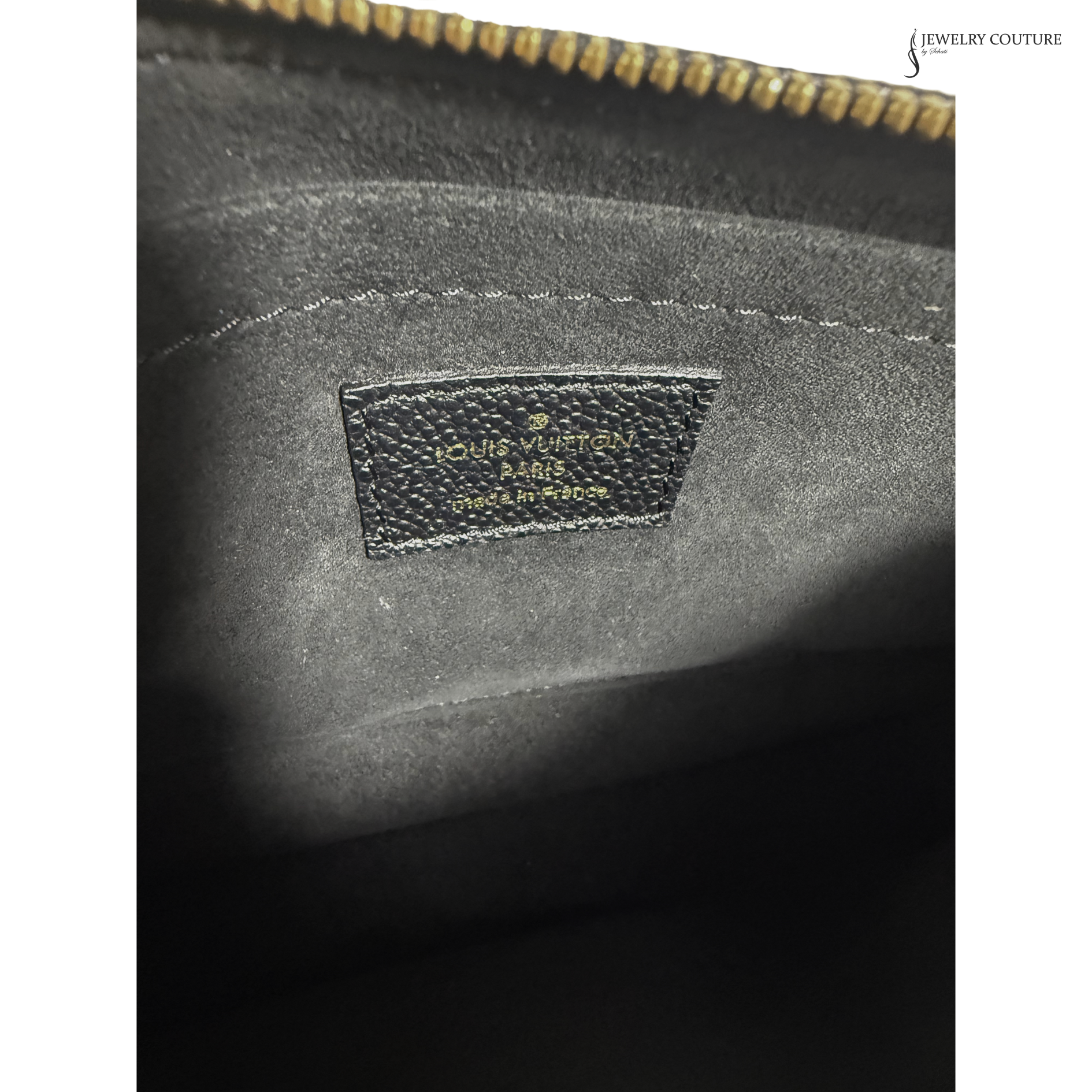 Close-up of a Louis Vuitton bag with a visible logo.
