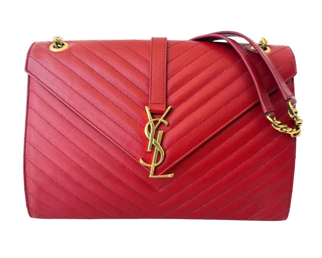 A red quilted leather shoulder bag with a flap front, gold-tone YSL monogram logo, and a gold chain detail, shown on a plain white background.