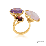 Two gold rings with colorful gemstones on a white background, labeled 'Jewelry Couture'.