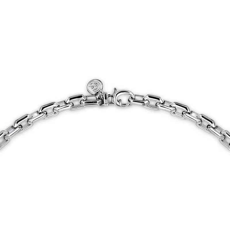 Silver bracelet with a clasp on a white background