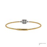A yellow gold box chain bracelet with a central silver-toned geometric charm featuring blue and white accents, displayed on a clean white background.
