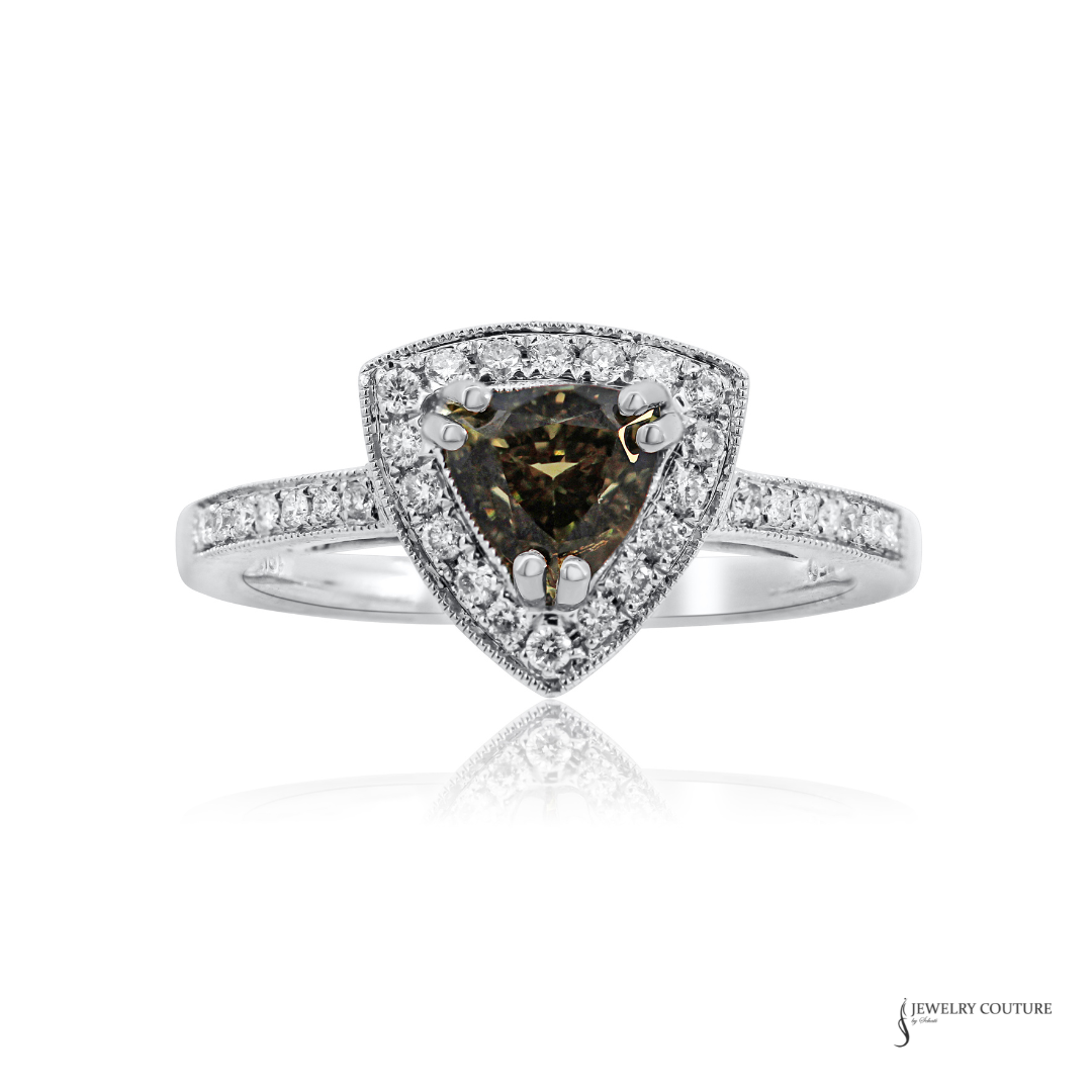 A triangular halo ring featuring a central brown alexandrite gemstone surrounded by a double halo of small clear stones, set on a silver-colored pavé band, shown on a white background with a reflection.