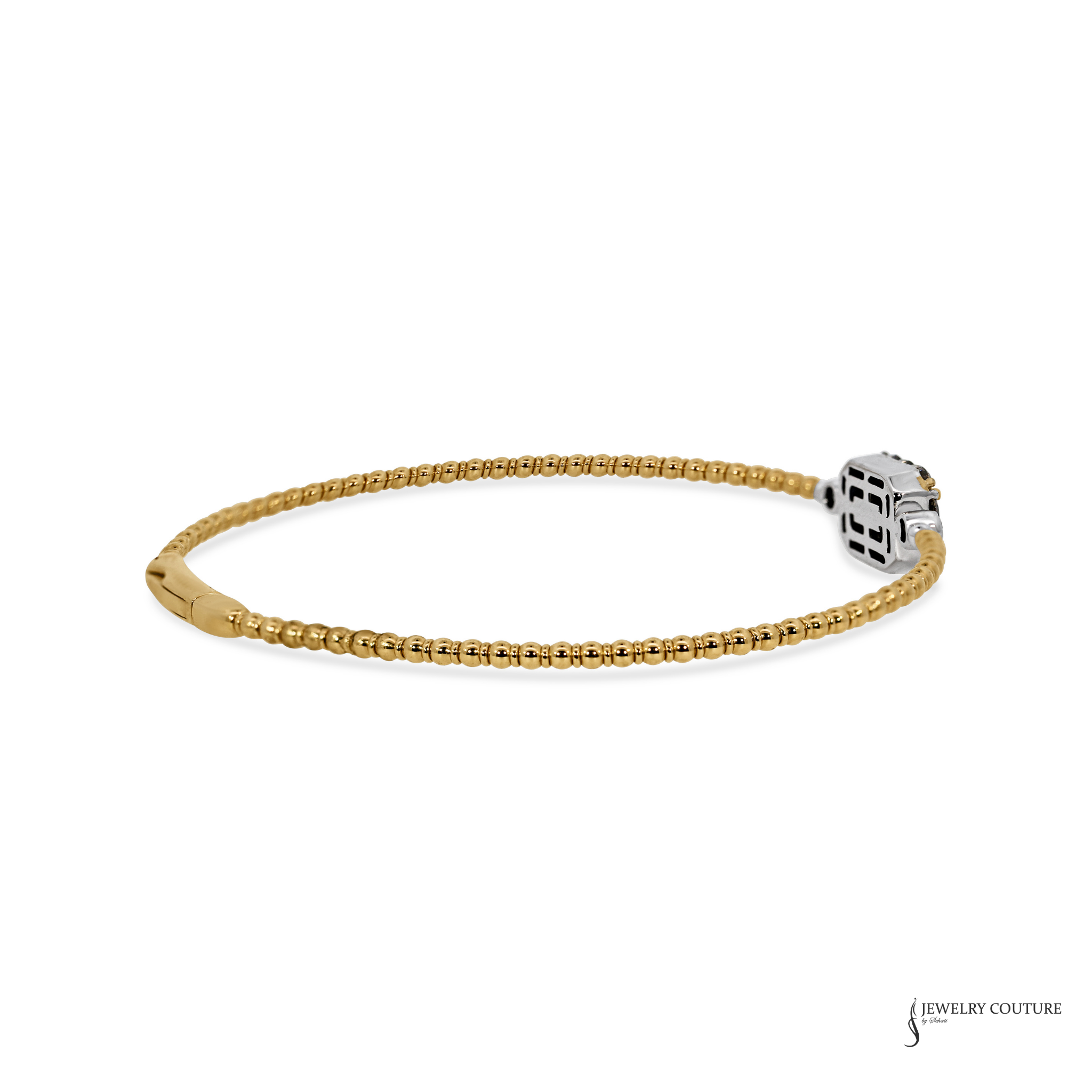A gold-plated tennis bracelet with a silver-toned geometric cube charm, displayed on a clean white background.