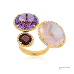 Three gold rings with colorful gemstones on a white background