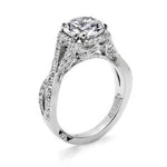 Silver ring with a large central gemstone and smaller stones on a white background