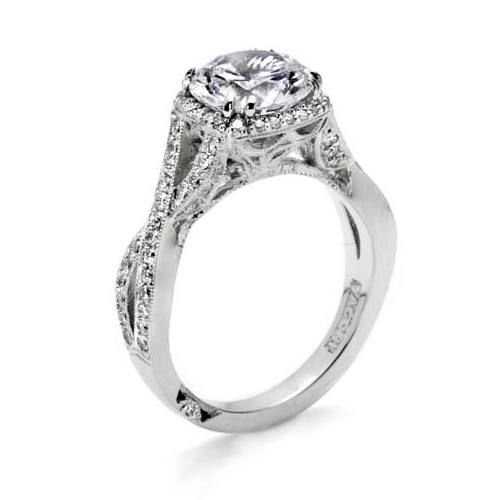 Silver ring with a large central gemstone and smaller stones on a white background