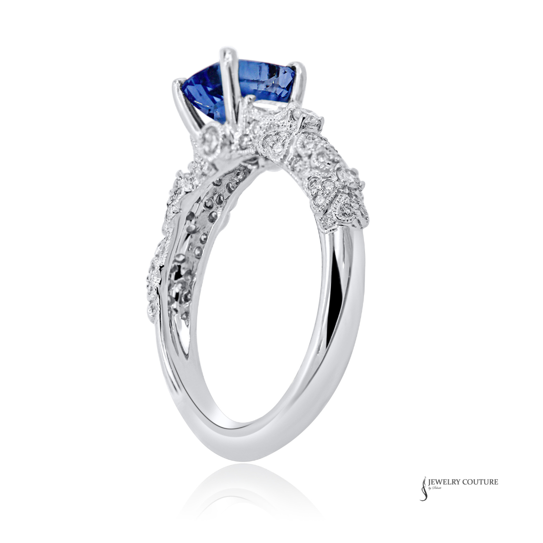 Silver ring with a blue gemstone on a white background