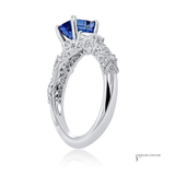 Silver ring with a blue gemstone on a white background