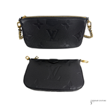 Two black handbags with gold accents on a white background, featuring the Louis Vuitton logo.