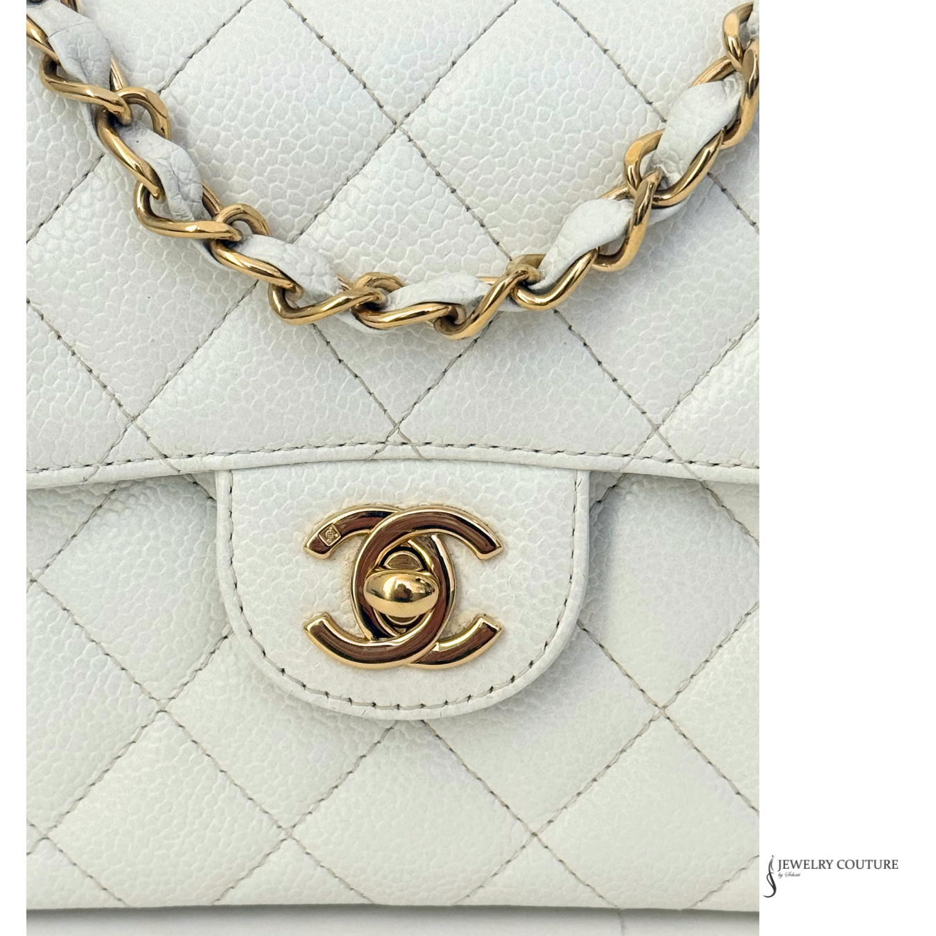 White quilted handbag with gold chain and logo on a white background