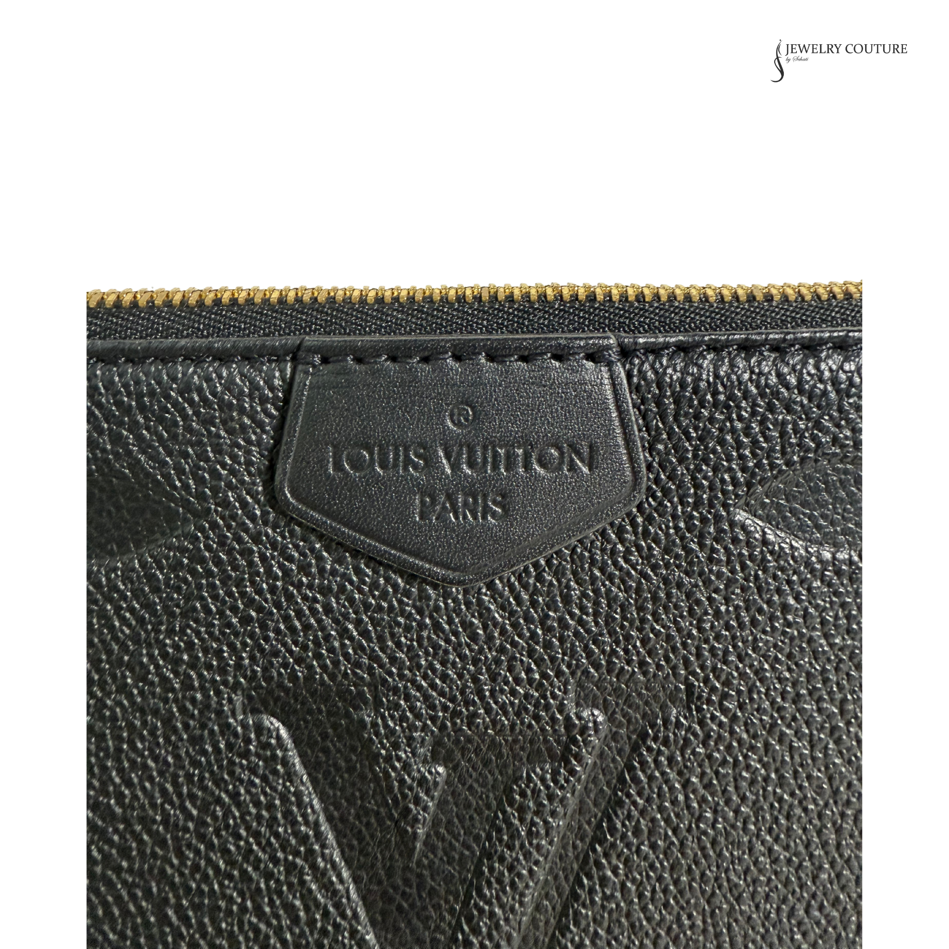 Close-up of a Louis Vuitton wallet with the brand logo.