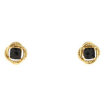 A pair of gold-toned twisted rope stud earrings with square-cut black gemstones, shown against a plain white background.