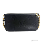 Black handbag with gold chain strap on a white background
