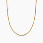 A gold-toned chain necklace with a textured, woven link design, shown against a plain white background.