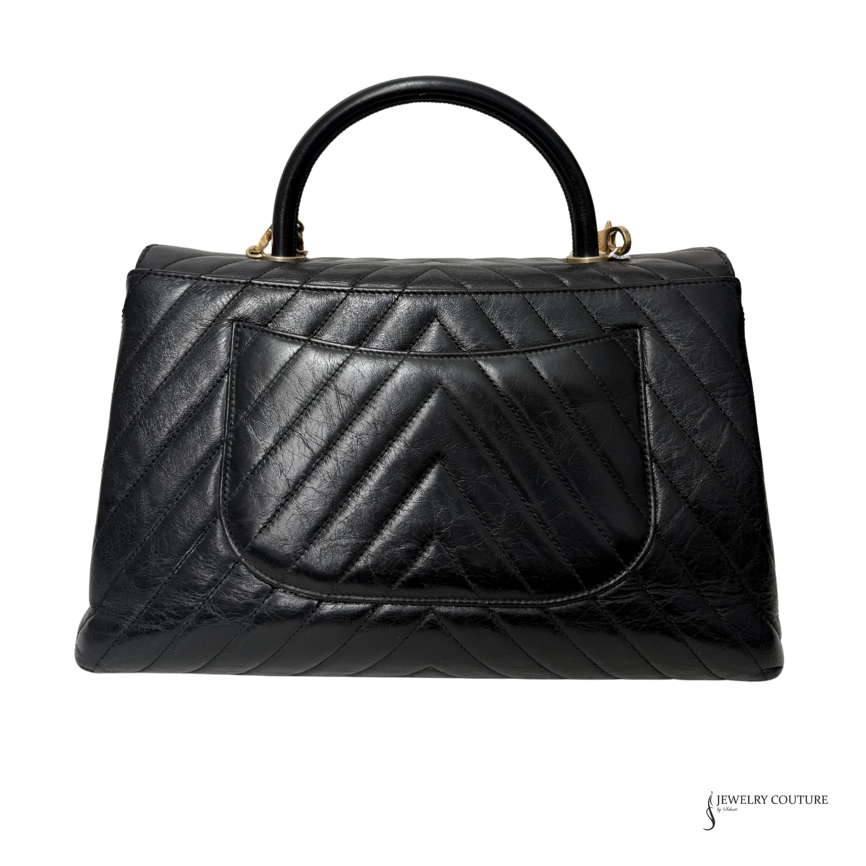 Black quilted handbag on a white background