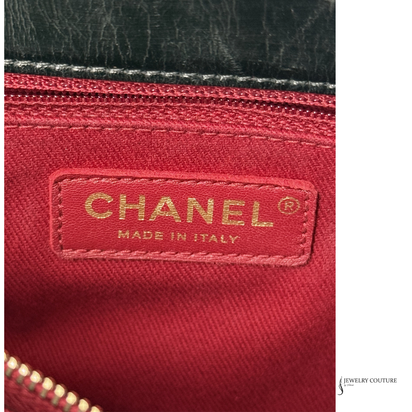Close-up of a Chanel logo on red fabric with 'Made in Italy' text.