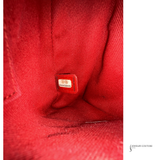 Close-up of a red fabric surface with a visible label.