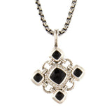 A silver-toned chain necklace with a geometric cross-shaped pendant featuring a central black square and four smaller black square accents, set against a plain white background.