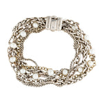 A multi-strand silver chain bracelet with white faux pearls, displayed on a clean white background. The clasp is a polished silver magnetic clasp, and the brand name 'SARAGO' is engraved on the metal.