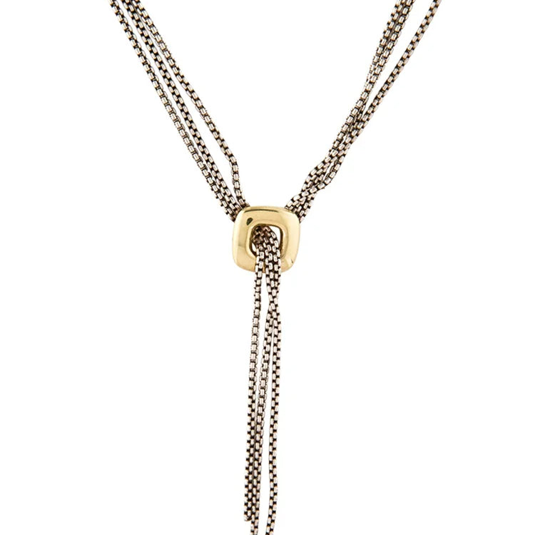 A multi-strand Y-necklace featuring antique silver-tone chains and a central square gold-tone pendant with a small clear gemstone, shown against a plain white background.