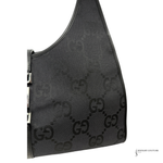 Black handbag with a pattern on a white background
