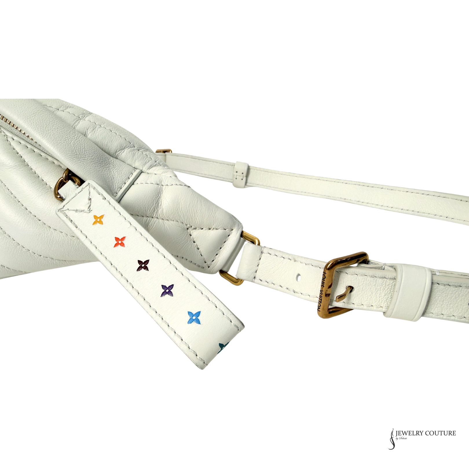 White leather bag with colorful floral embroidery on a white background