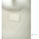 Close-up of a textured fabric surface with a visible label, featuring the brand 'Jewelry Couture'.