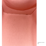 Close-up of pink fabric with 'Jewelry Couture' branding.