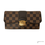 Designer wallet with checkered pattern and gold clasp on a white background