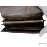 Brown leather wallet with gold zipper on a white background