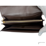 Brown leather wallet with gold zipper on a white background
