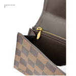 Brown checkered pouch with gold zipper on a white background